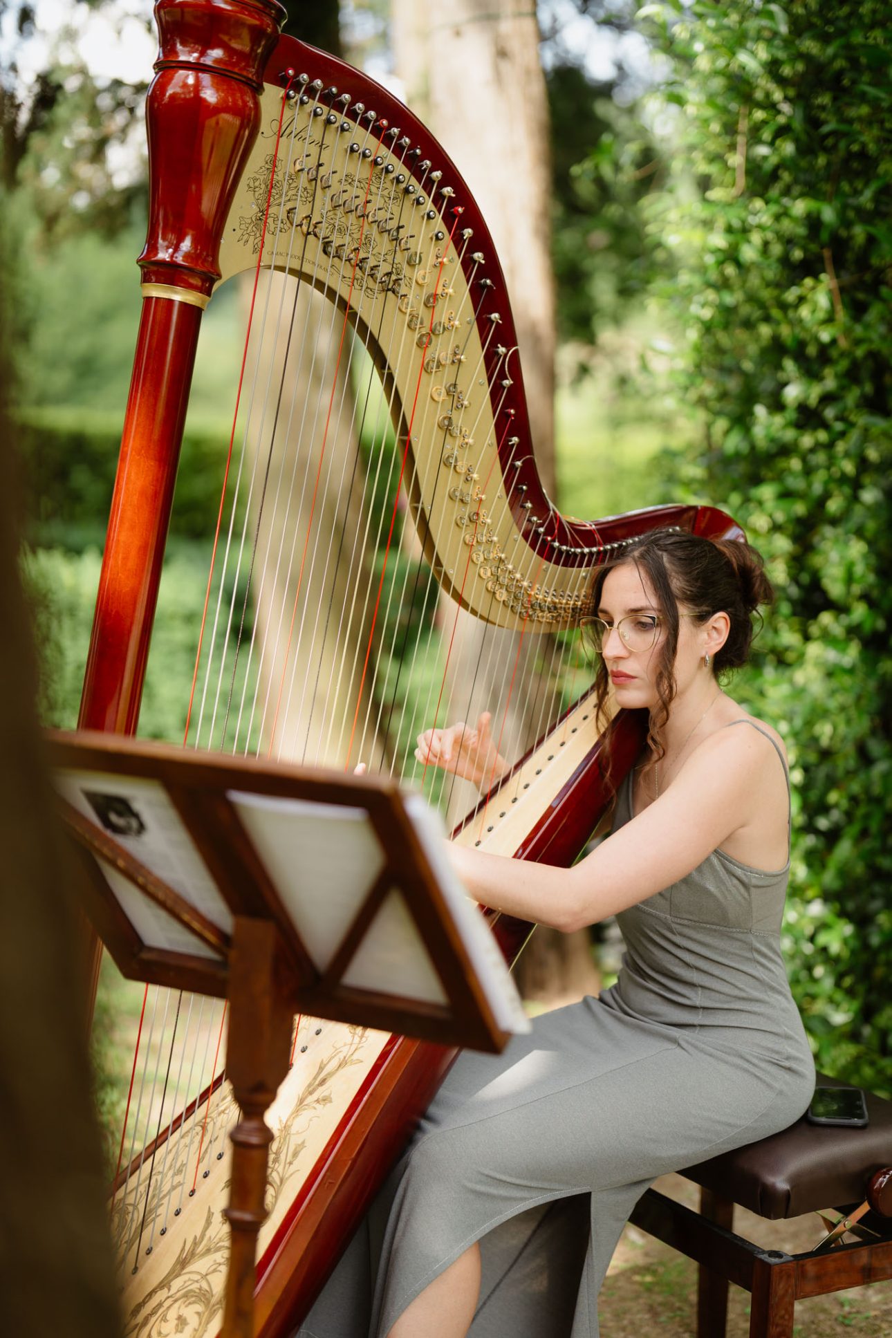 harf player during outdoor wedding ceremony in Tuscany