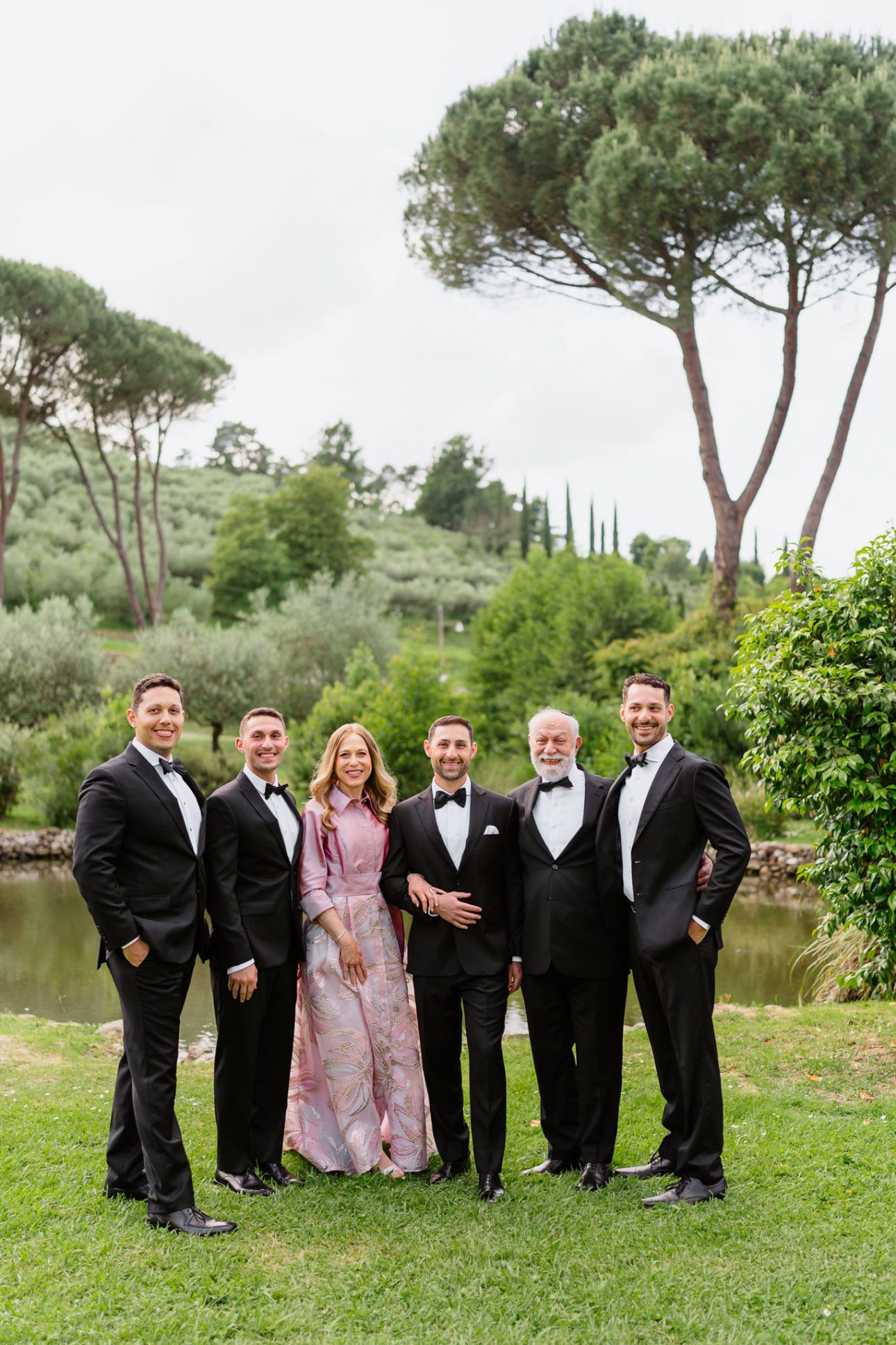 Groom and family portrait in Tuscany garden