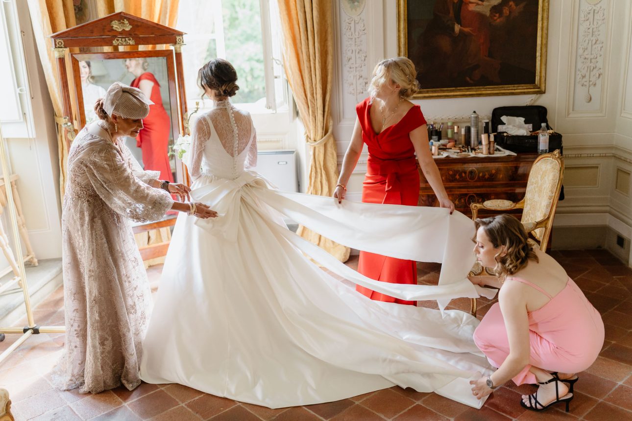 Emotional moment between bride and mother and bridesmaids